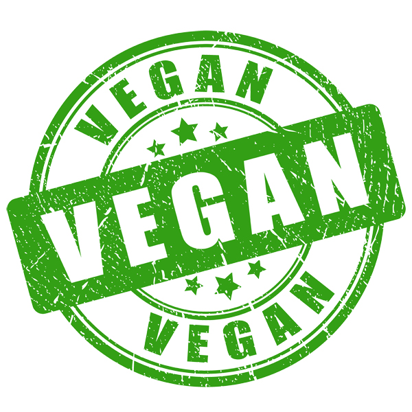Green circular stamp with the word VEGAN in the center and around the circle, with stars and a distressed look.
