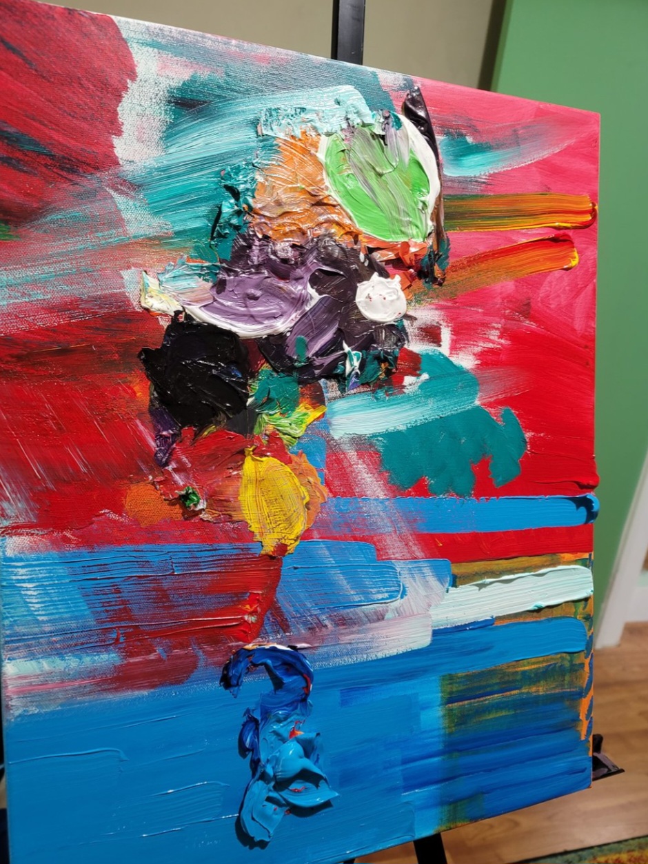Abstract painting with vibrant colors including red, blue, green, yellow, black, and white, with textured brushstrokes.