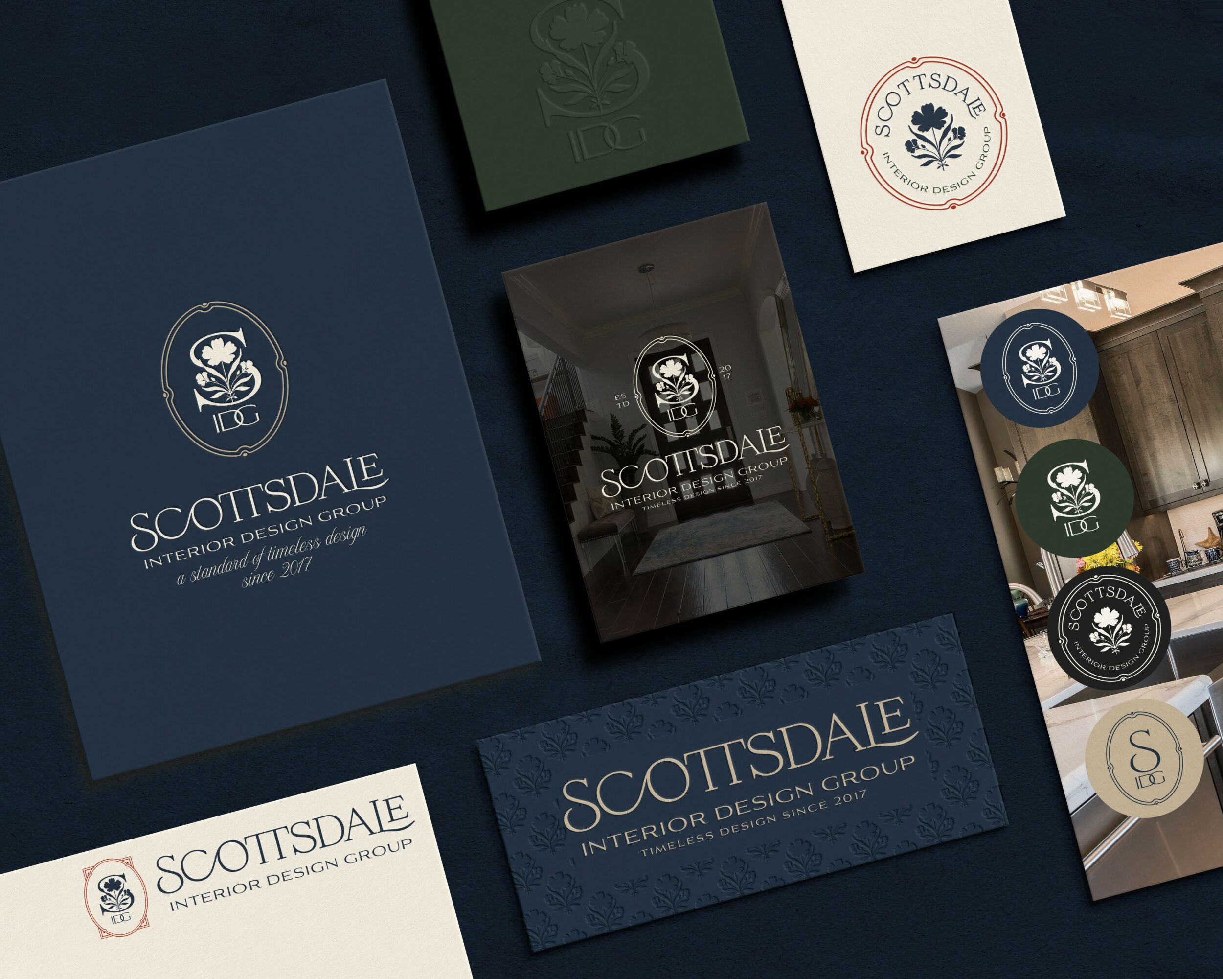 Various branded cards and packaging for ScotsDale, a design group, with logos and text on dark backgrounds.