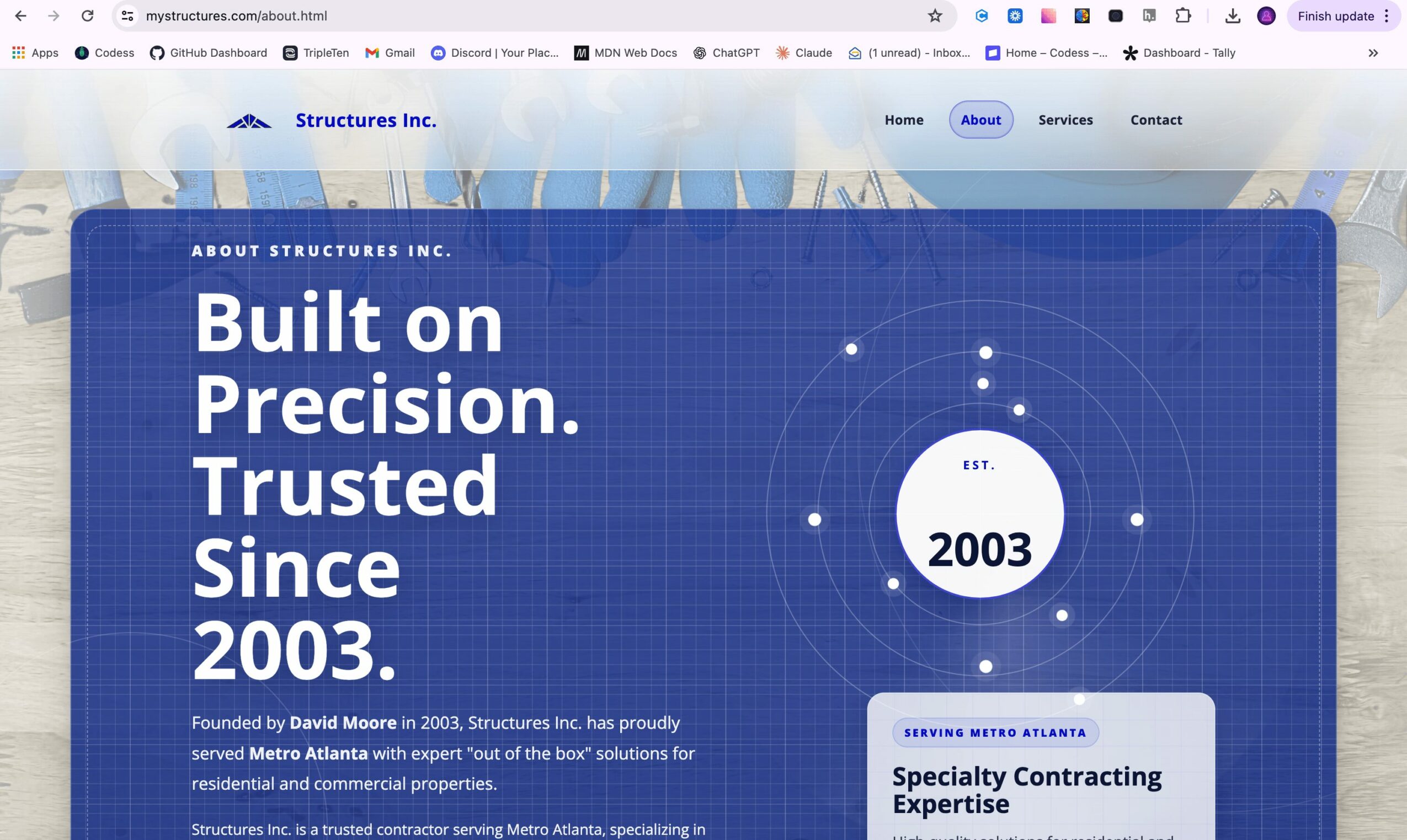 Screenshot of a website with blue background, white text, and a circular graphic with '2003' inside.