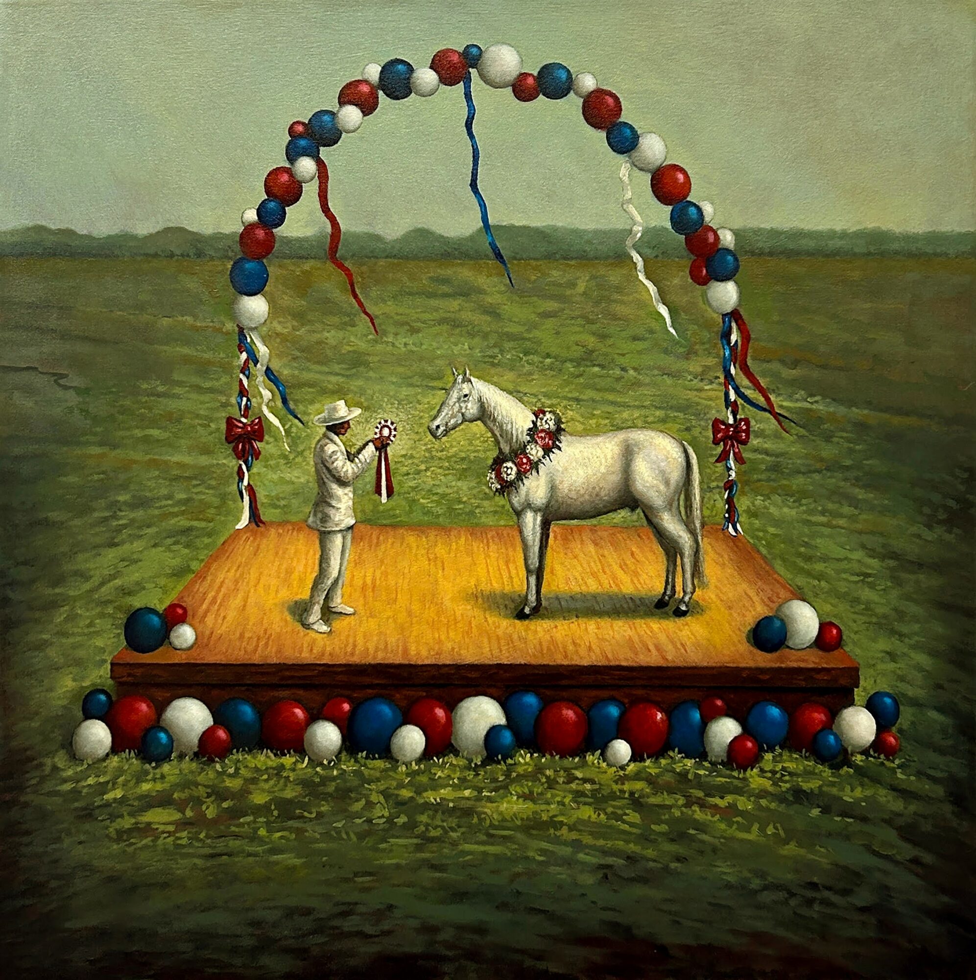 A puppet show stage with a person, a horse, and decorative elements, set outdoors on grass with a cloudy sky.