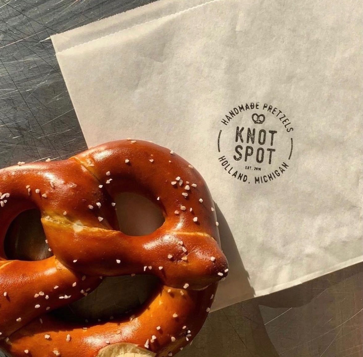 Salted pretzel with coarse salt on a paper bag from Knot Spot, Holland, Michigan.