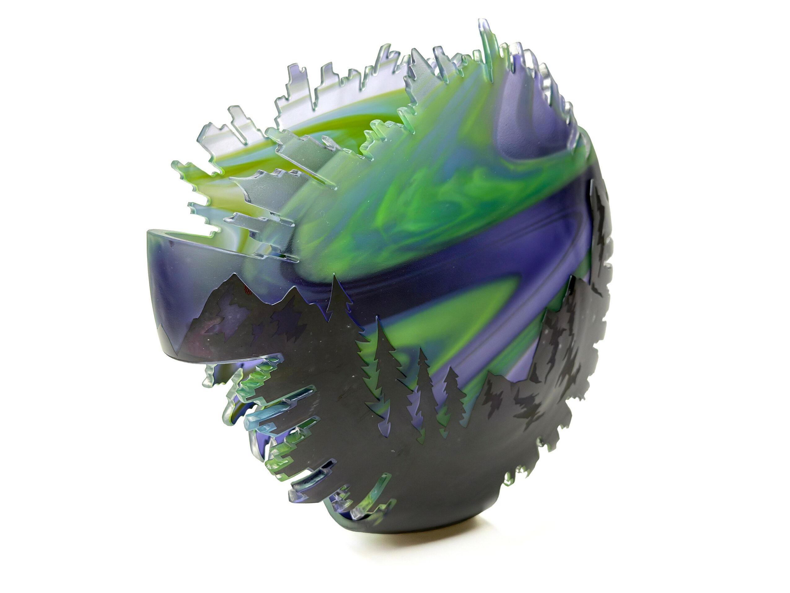 Colorful abstract sculpture with green, purple, and black swirls and tree silhouettes, shaped like a rounded vessel.