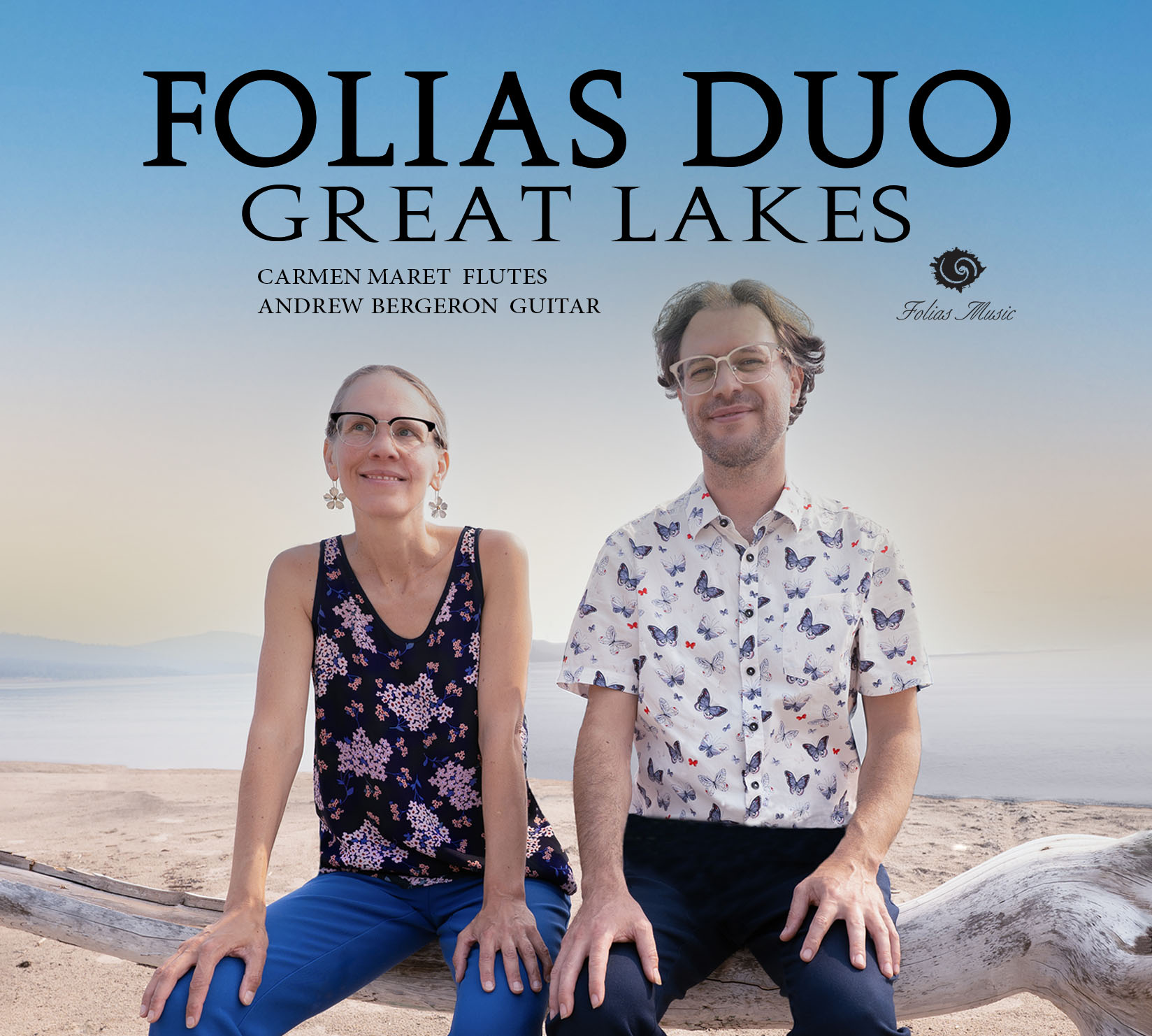 Two musicians sit on a beach with a lake in the background, smiling, with text about a duo and their instruments.