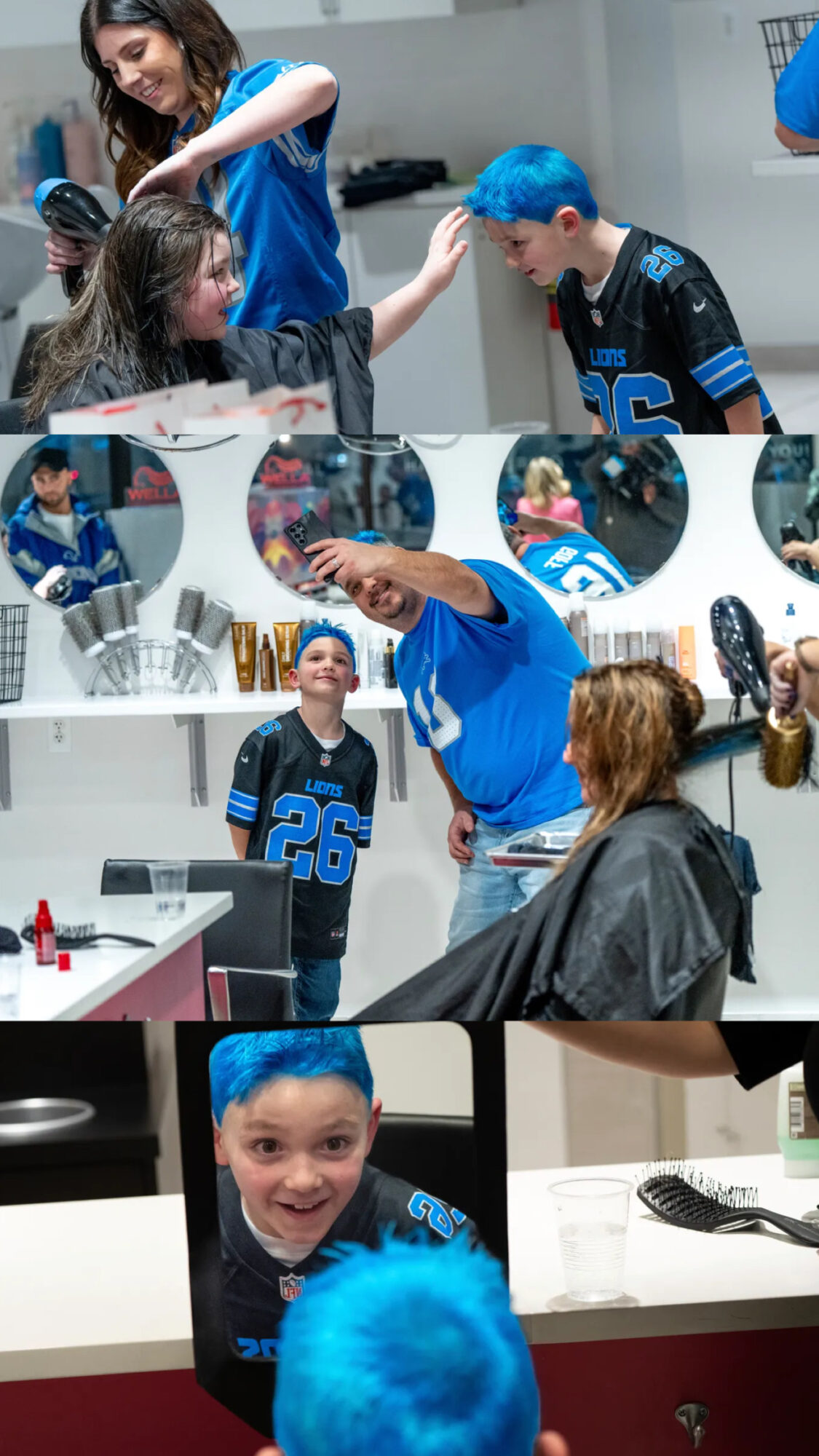 Children and adults with blue hair in a hair salon, some getting haircuts, others chatting and smiling, in a lively environment.