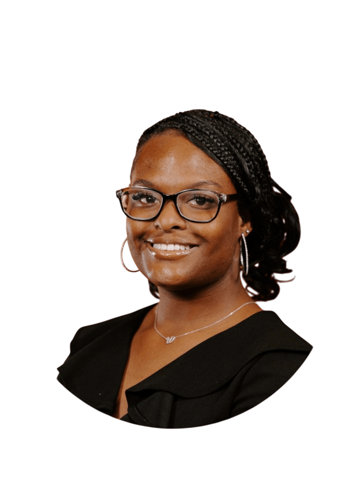 Portrait of a smiling woman with glasses, hoop earrings, and braided hair, wearing a black top against a black background.