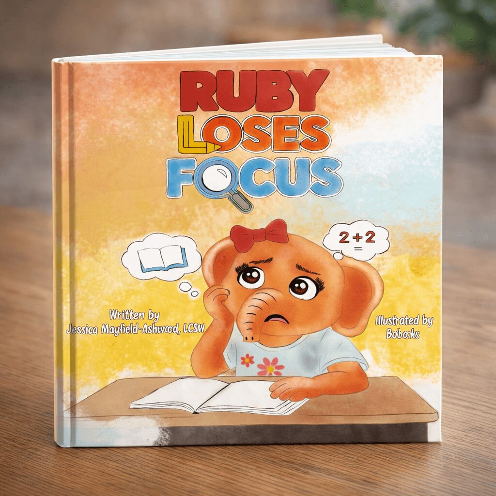 Children's book cover titled 'Ruby Loses Focus' featuring a sad cartoon dog with a red bow, sitting at a desk.