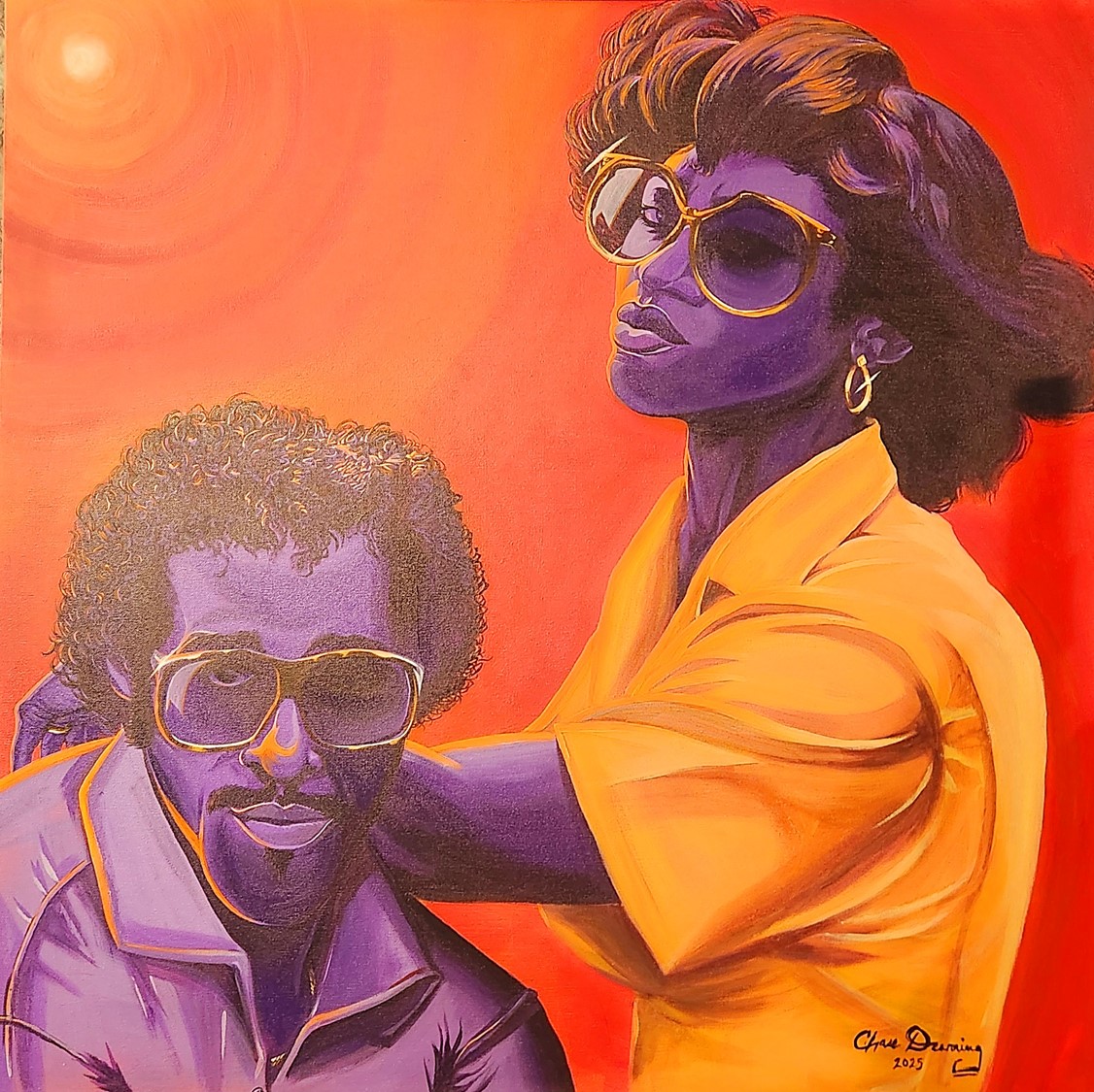 Two people wearing sunglasses, one with curly hair and the other with straight hair, against a red background.