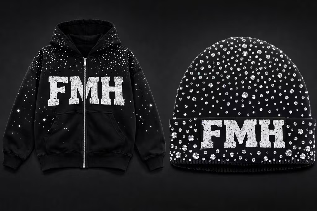 Black hoodie and beanie with white text and dotted pattern, displayed against a dark background.