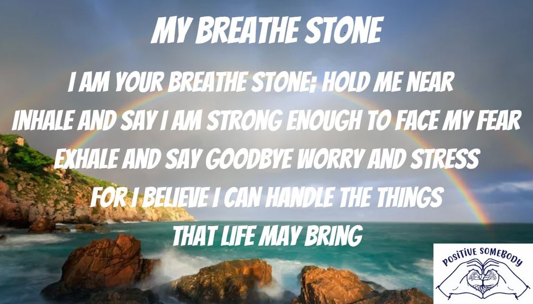 Text overlay on a scenic ocean view with rocks and a rainbow, displaying a motivational message about breathing and life.