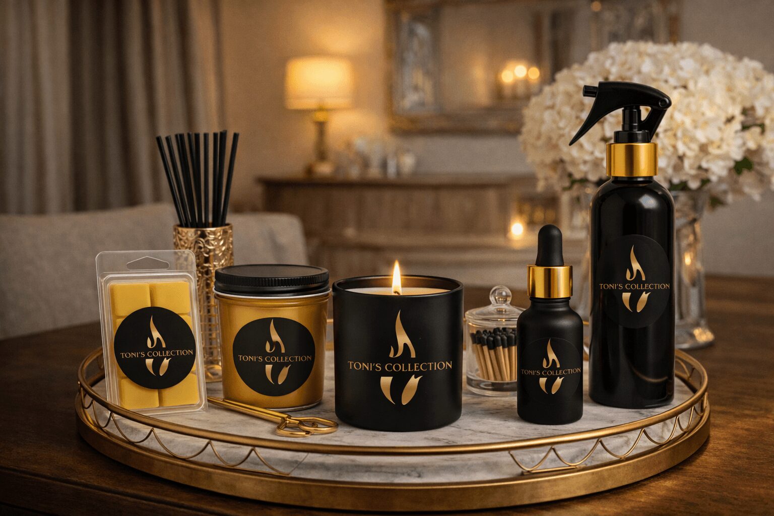 A tray with candles, diffuser, and decorative items on a table, with a lamp and flowers in the background.
