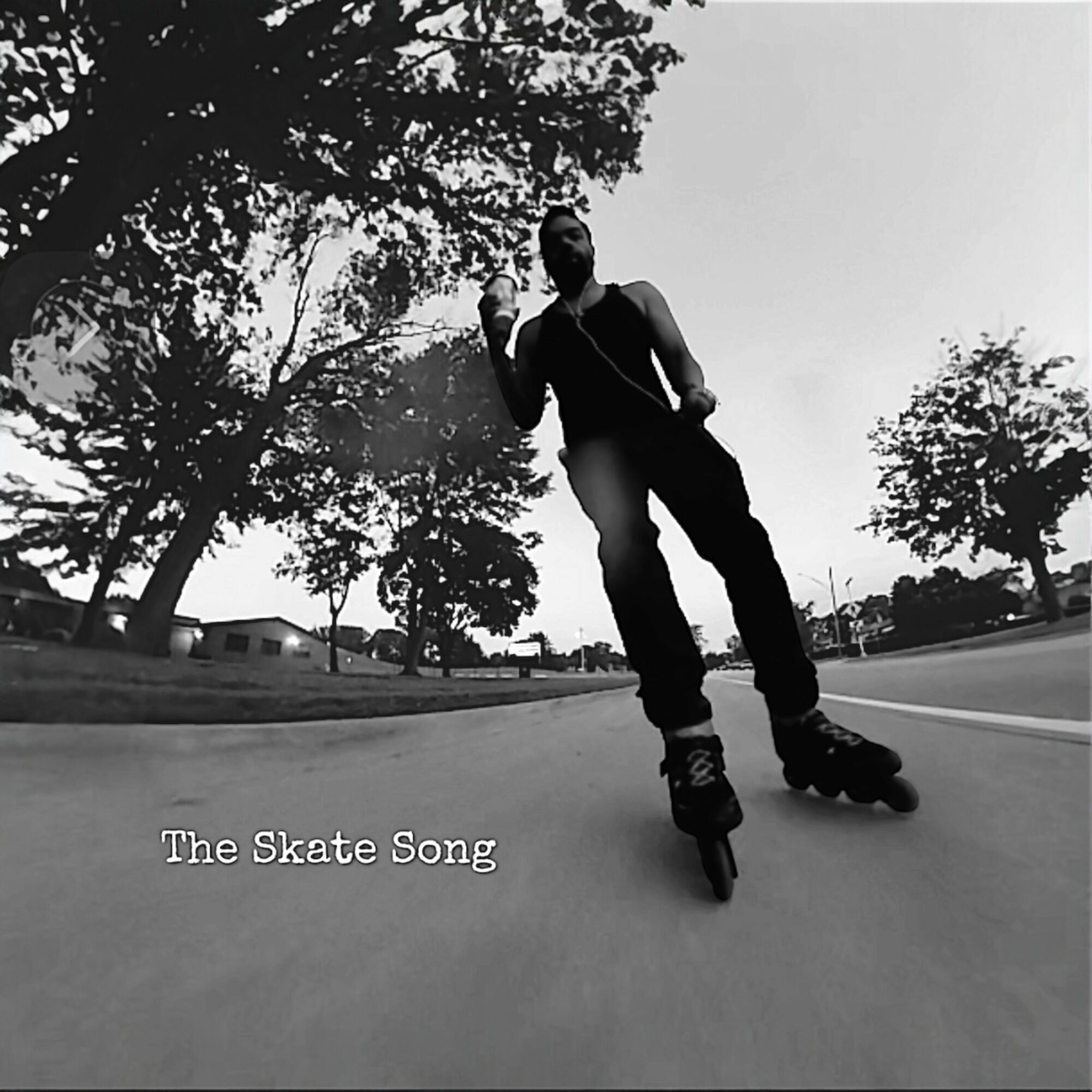 Person roller skating on a street with trees and houses in the background, holding a phone, in black and white.