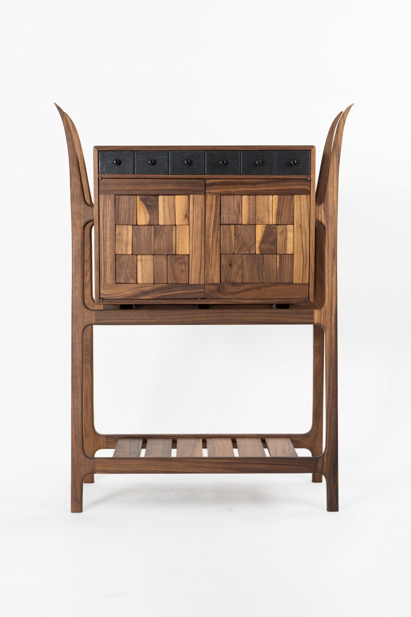 Wooden cabinet with black drawers and a lower shelf, viewed from the front, against a white background.