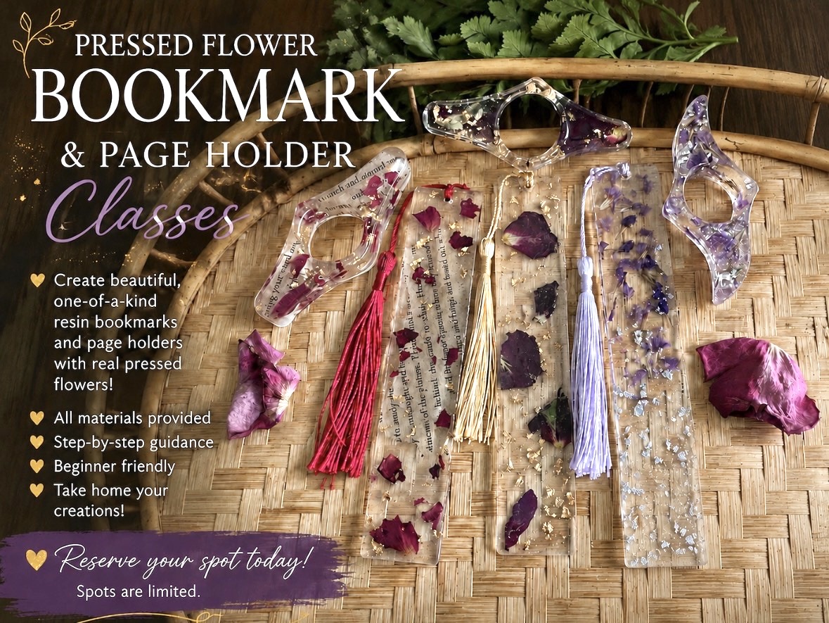 Pressed flower bookmark and page holder with purple and red pressed flowers, tassels, and a woven basket background.
