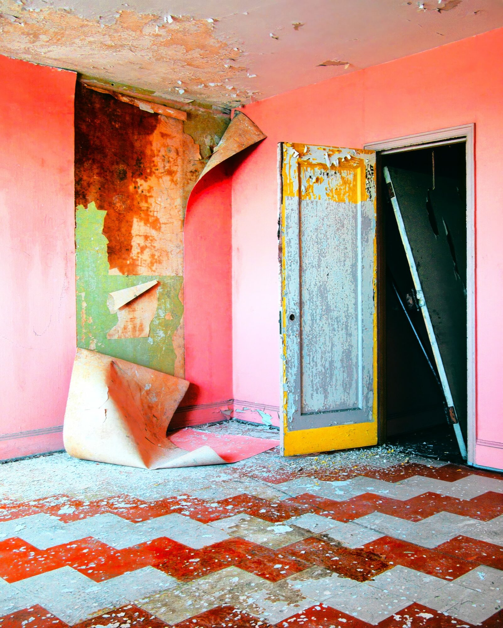Room with peeling paint, damaged walls, and a partially open door, showing debris and a zigzag patterned floor.