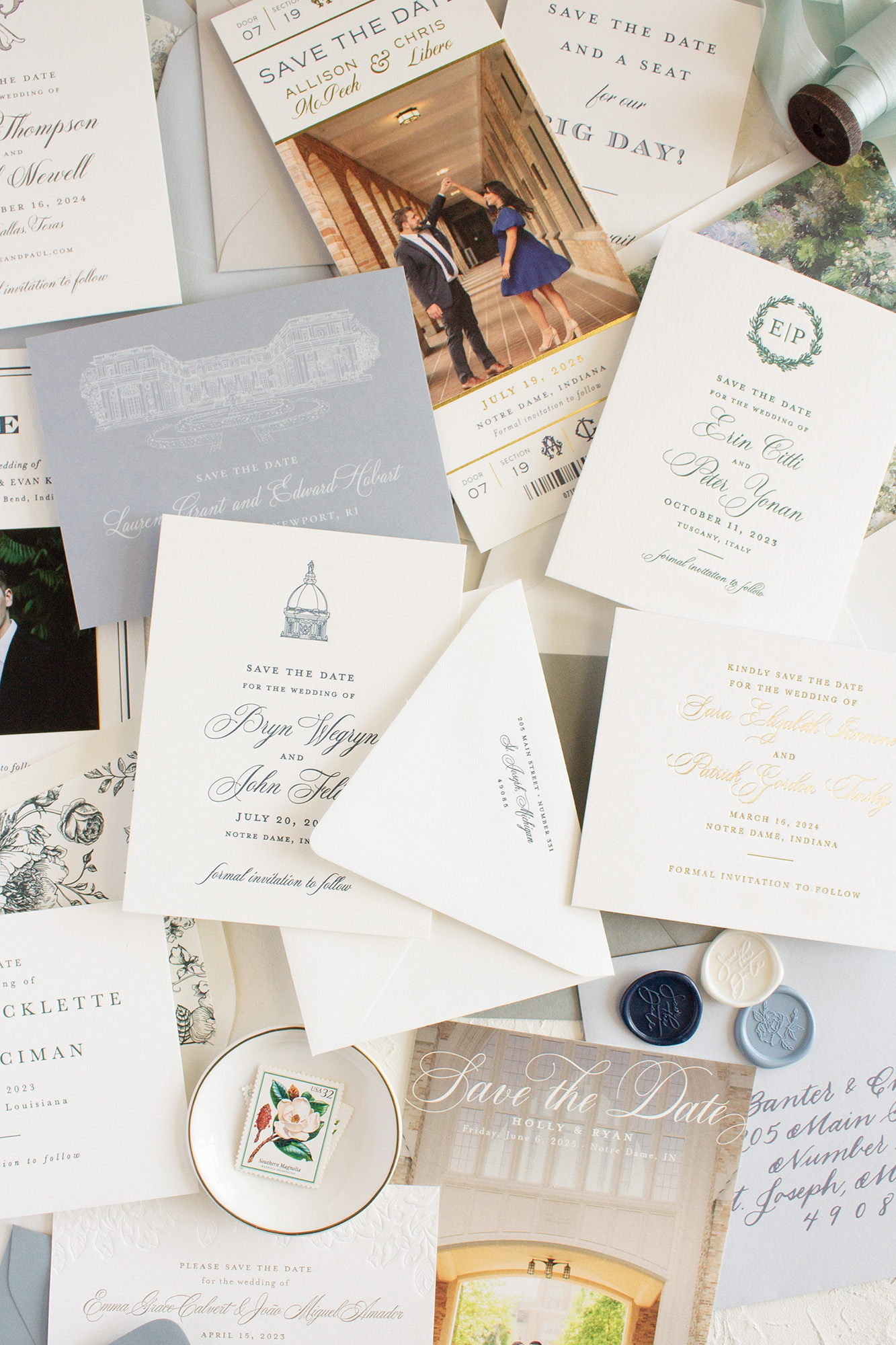 Collection of wedding invitations, save-the-date cards, and stationery with elegant designs and text, arranged on a surface.