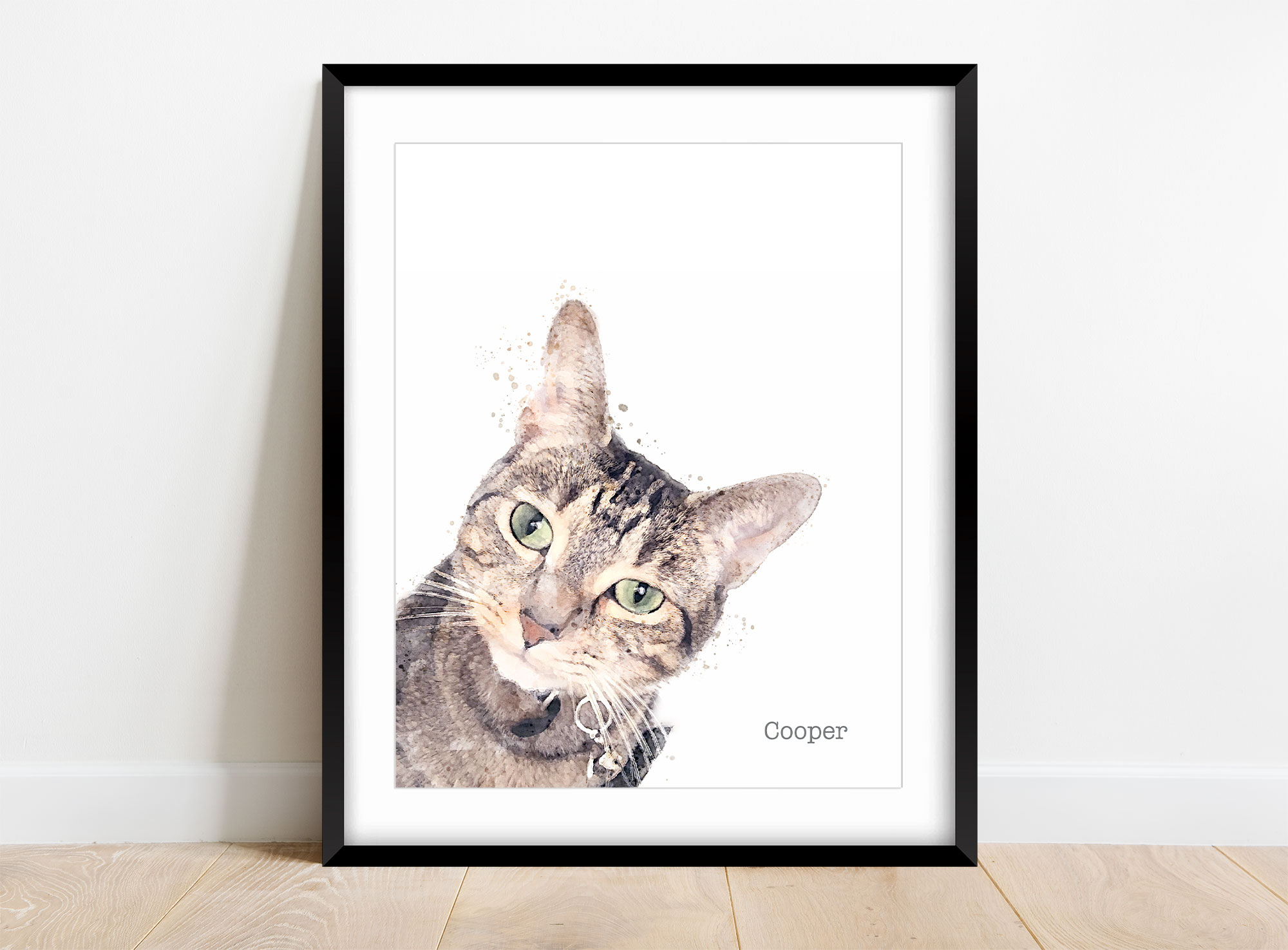 Framed watercolor portrait of a cat with green eyes, labeled 'Cooper', leaning forward, against a white background.