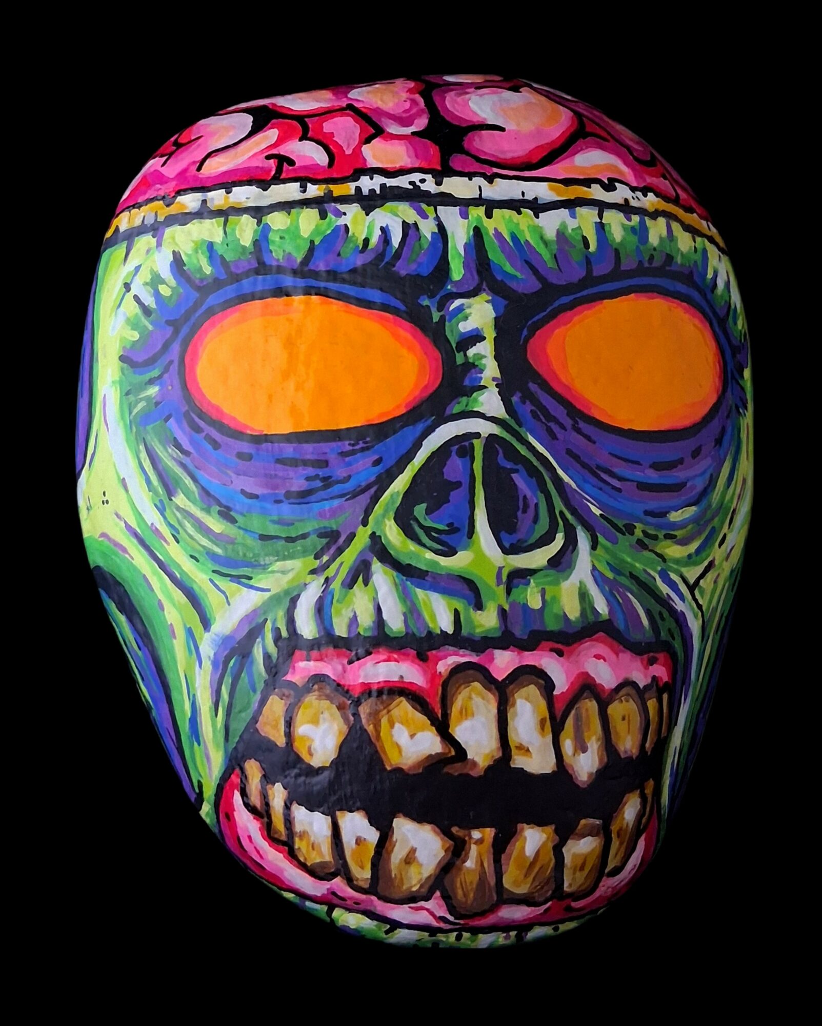 Colorful skull with orange eye sockets, green, purple, pink, and yellow details, and a black background.