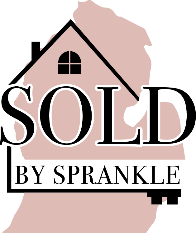 House with a sold sign in front, indicating a property has been purchased, with a tree and sky background.