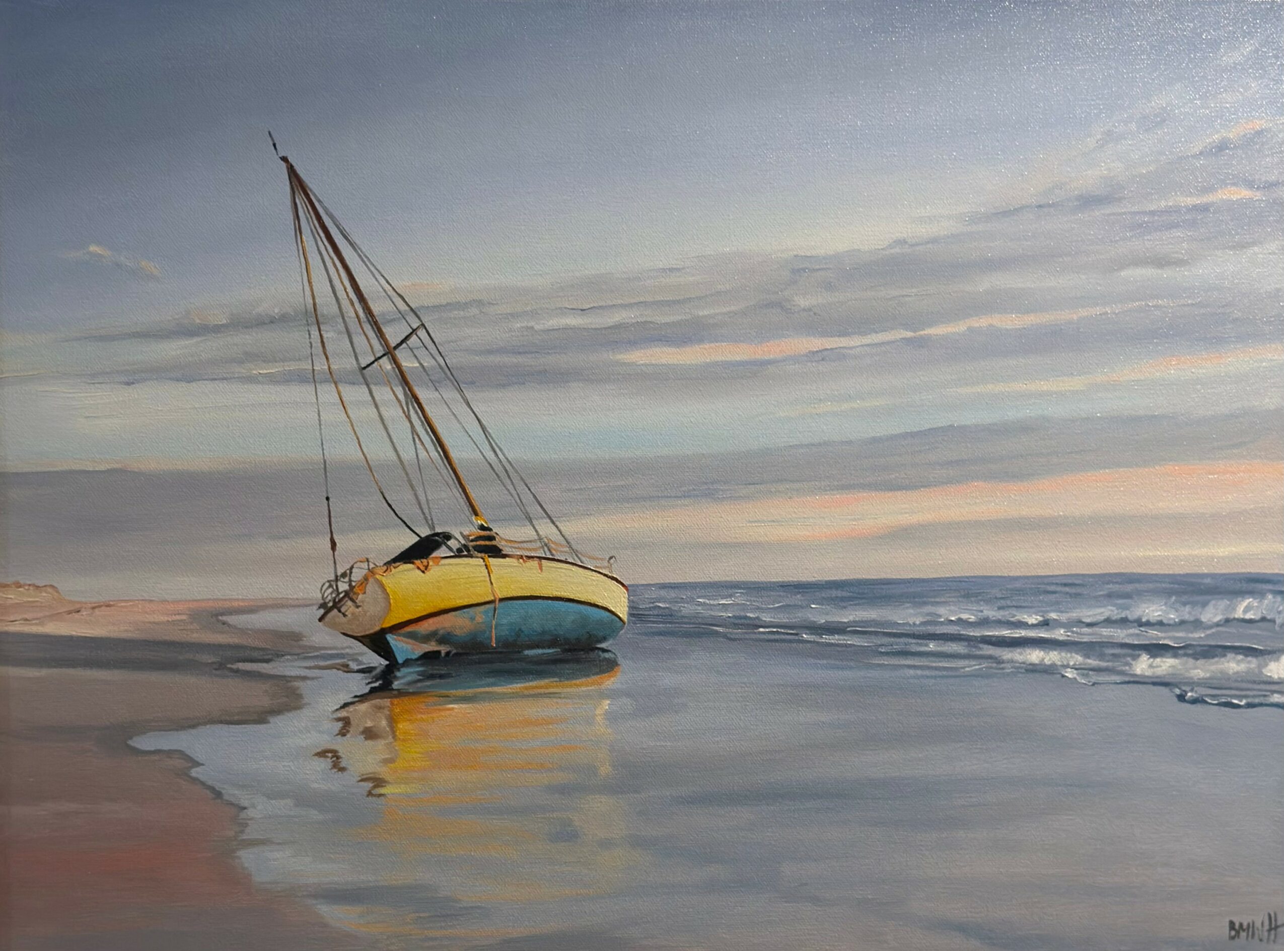 Sailboat resting on the shoreline with calm water and a cloudy sky in the background.