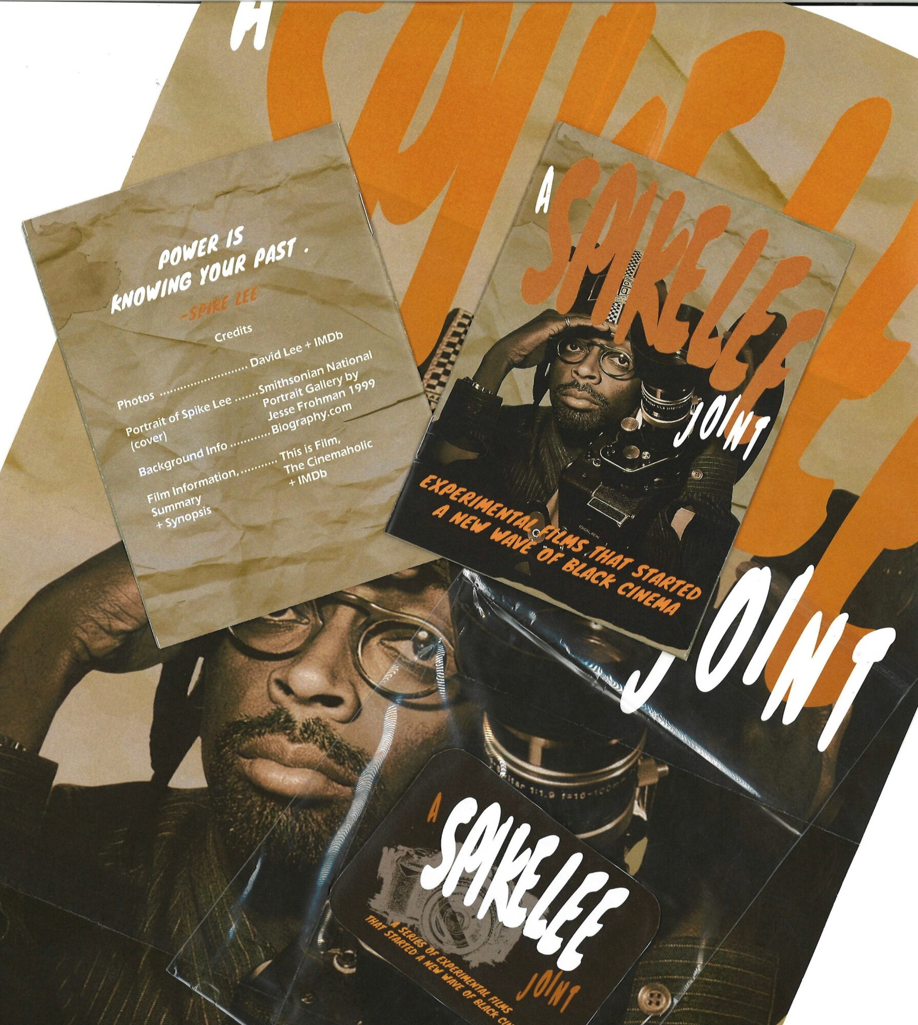 Multiple overlapping posters featuring a man with glasses and a beard, with text about power and success, in orange, black, and white colors.