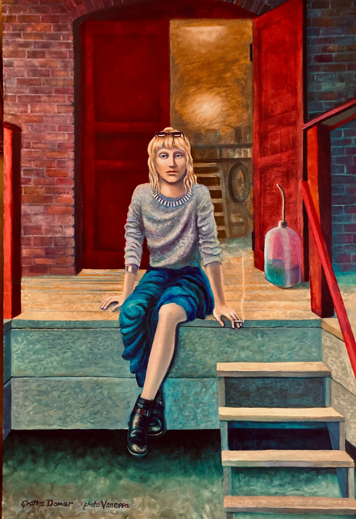 Young woman with blonde hair sitting on steps outside a brick building, wearing a gray sweater and blue skirt, with a red door behind her.