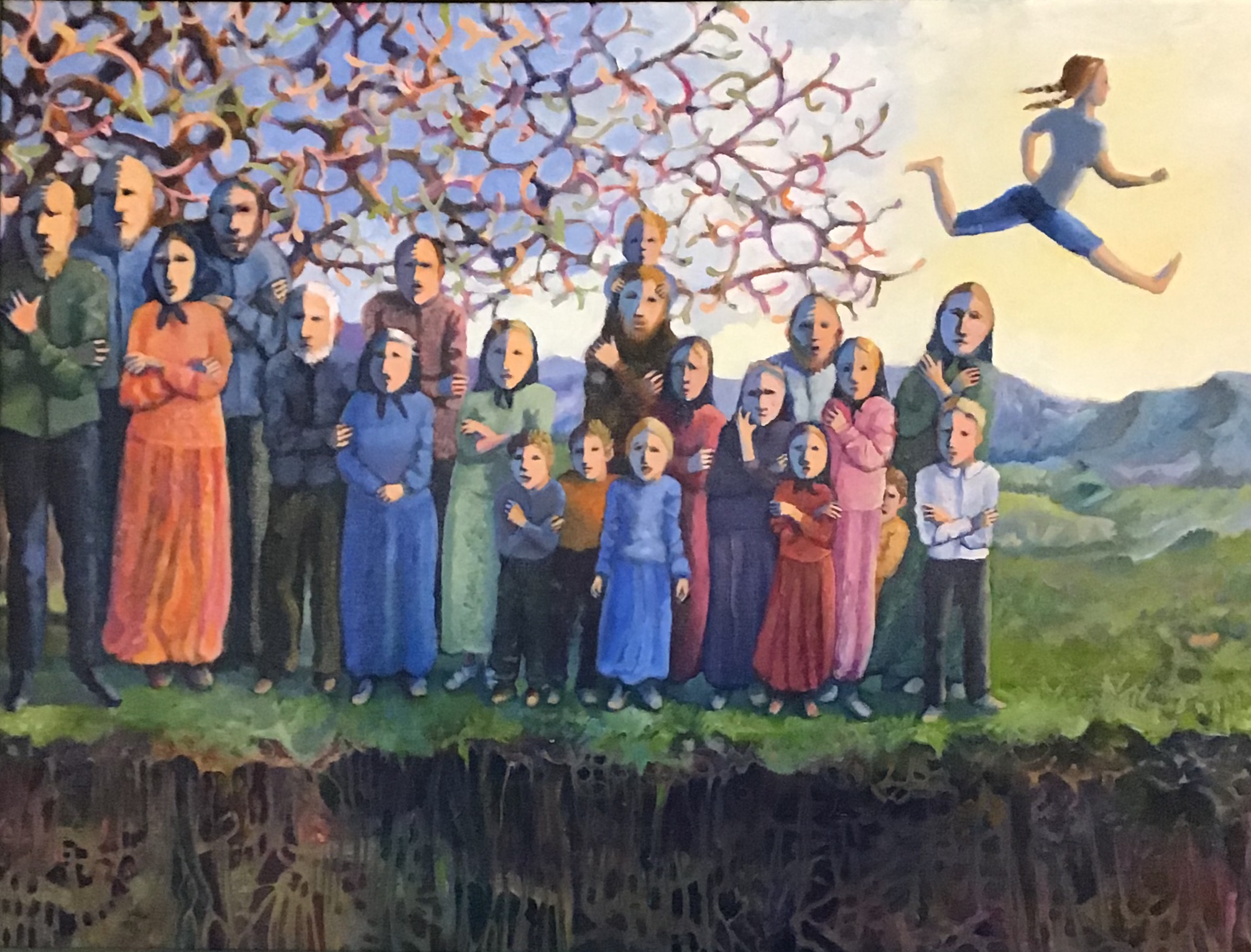 Group of people standing outdoors under a tree, with a person jumping in the sky, mountains in the background.