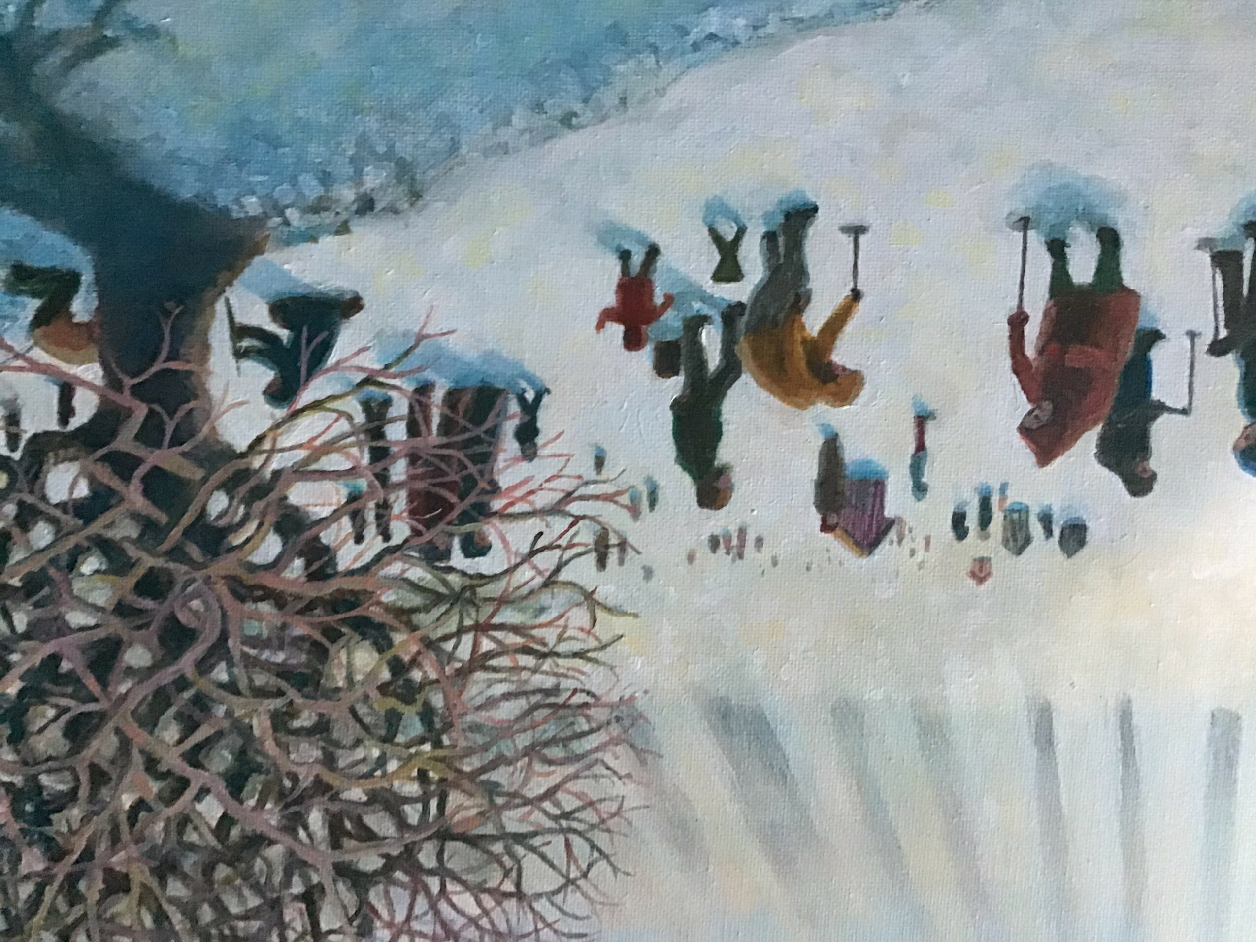 People walking and playing in a snowy landscape with a tree on the left side, upside down due to rotation.