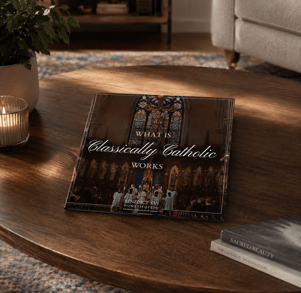 Book titled 'What is Classically Catholic Works' on a wooden table, with a candle and other books nearby.