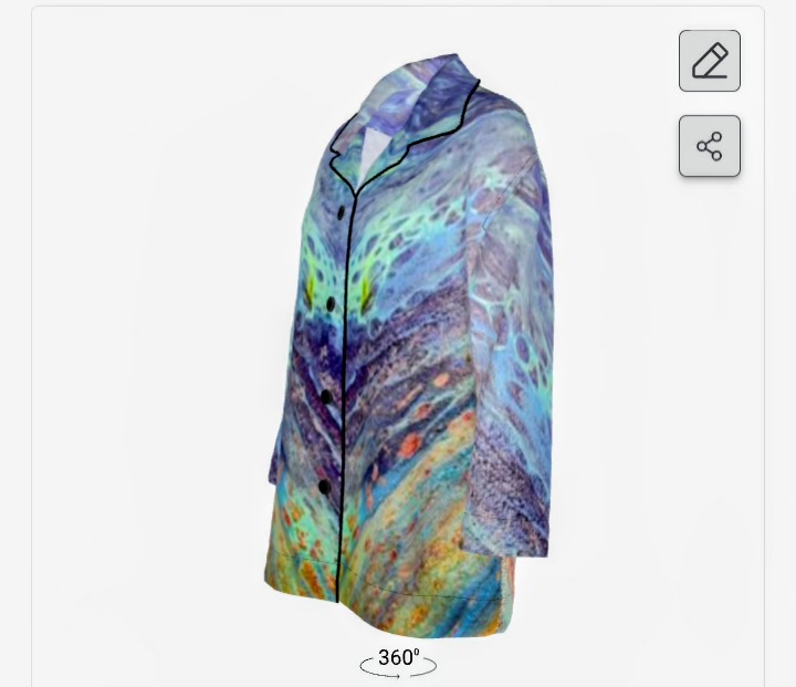 Long-sleeved shirt with a colorful, abstract pattern, button-up front, and collar, displayed on a white background.