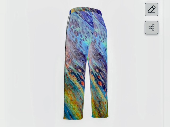 Colorful patterned pants with blue, green, yellow, and purple hues, displayed against a white background.