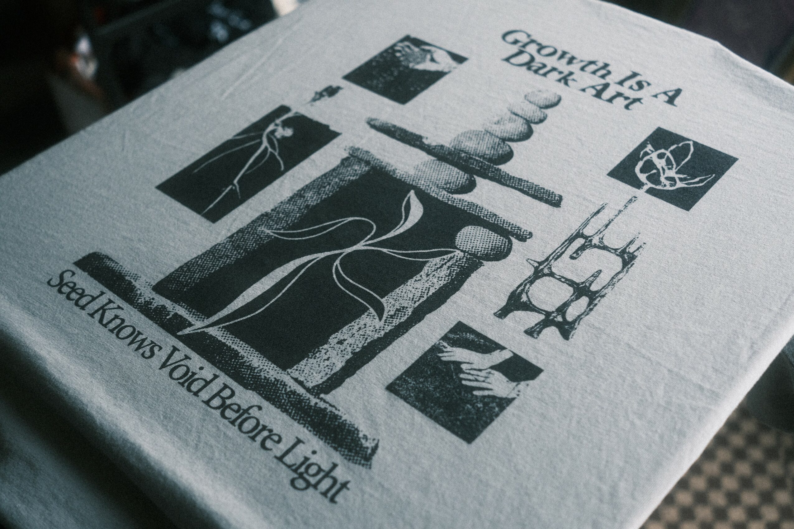 Book cover with black and white abstract artwork and text, including a quote about dark art and light knowledge.