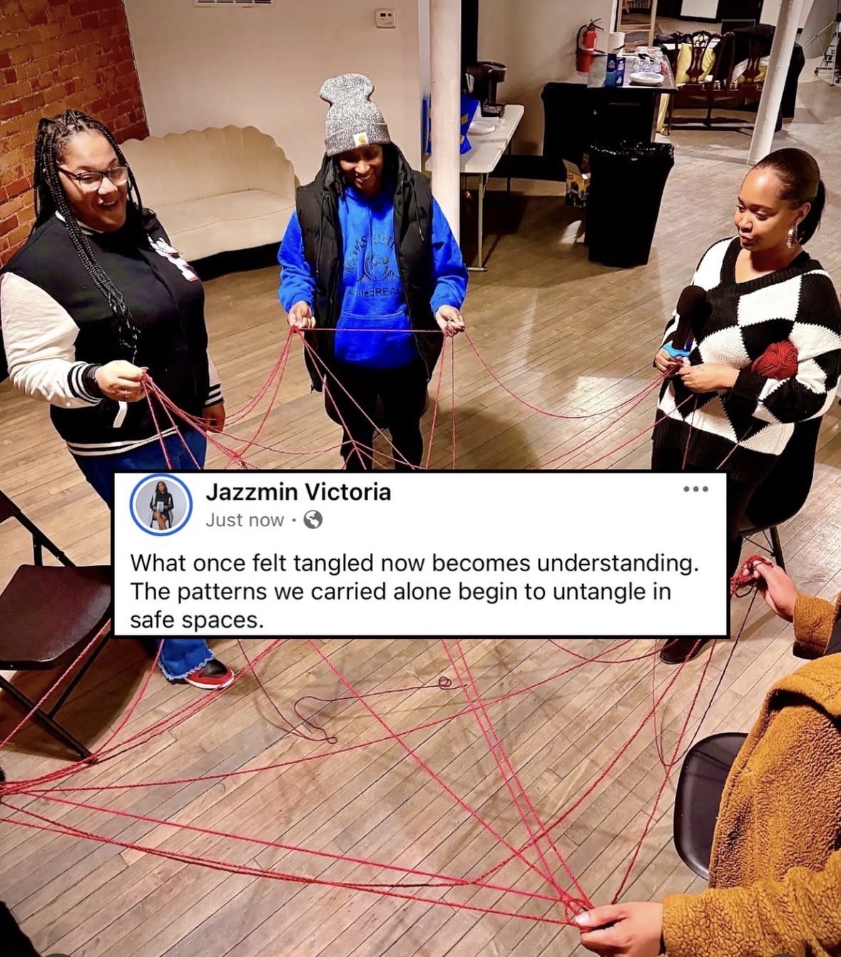 Three women stand in a room holding red strings connected to each other, forming a web-like pattern on the floor, with a Facebook post overlayed.