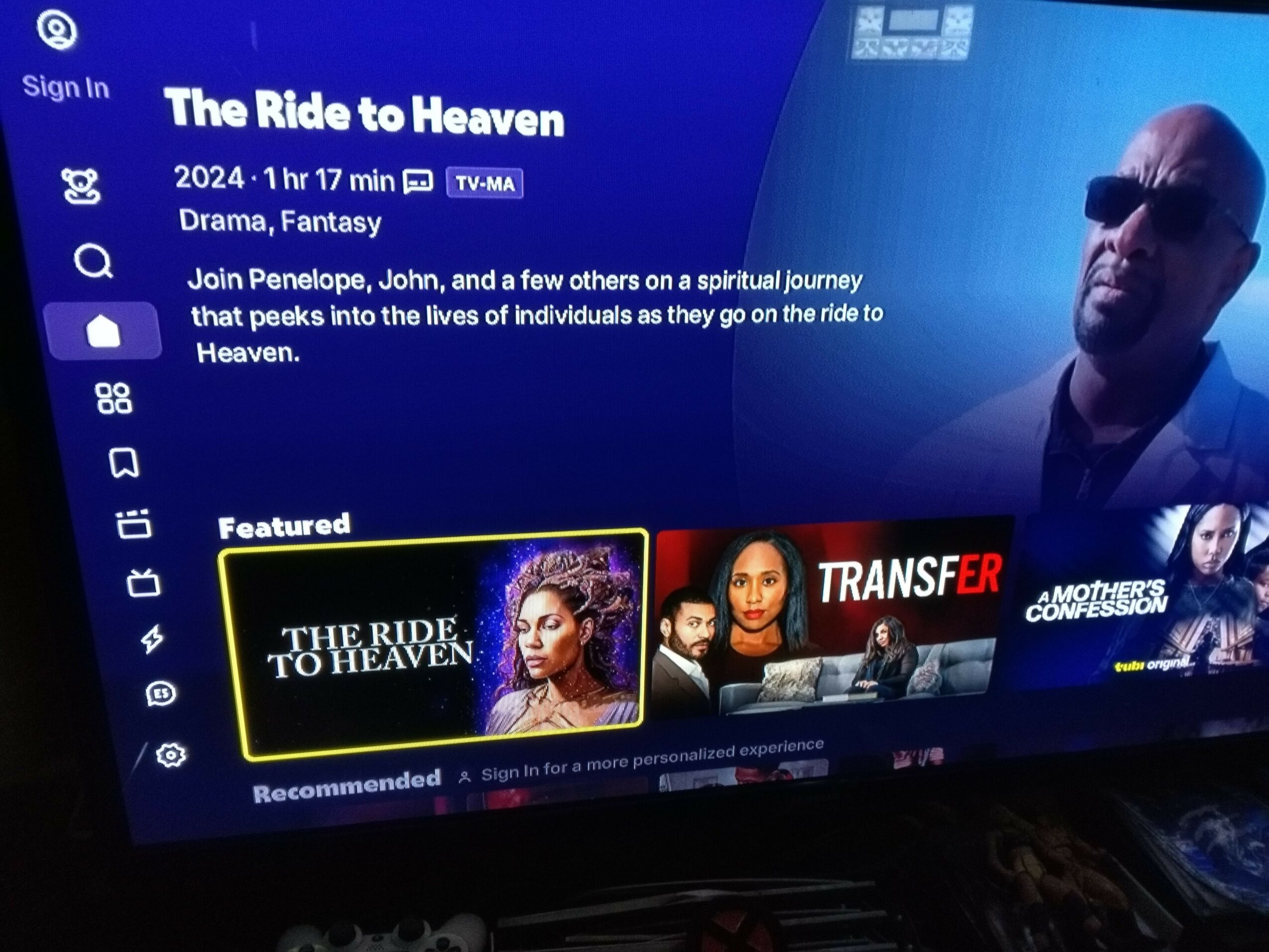 Screen displaying a streaming platform with a movie titled 'The Rise of G-Dragon' and a blue background.