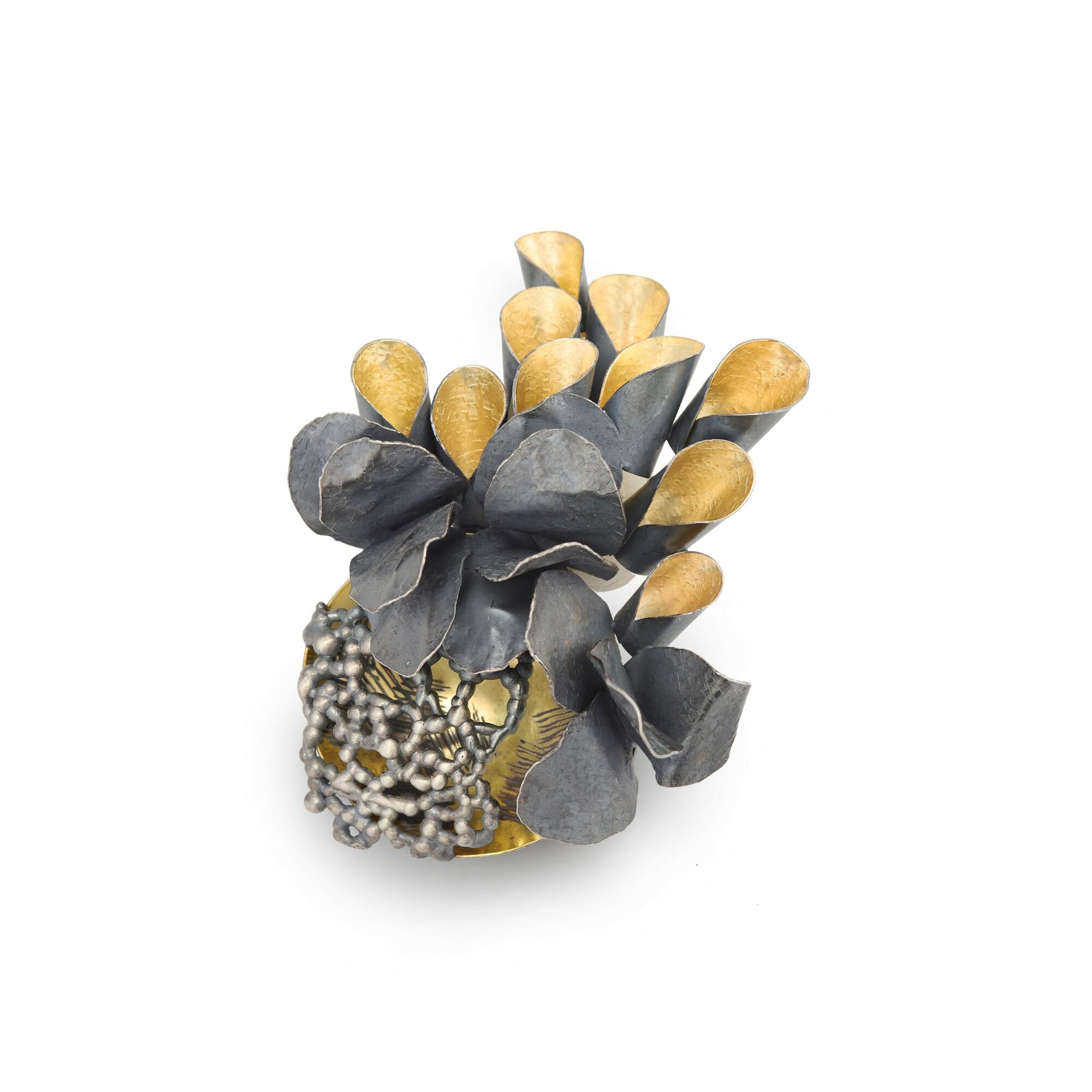 Decorative object resembling a flower with yellow-tipped gray petals and a beaded base.