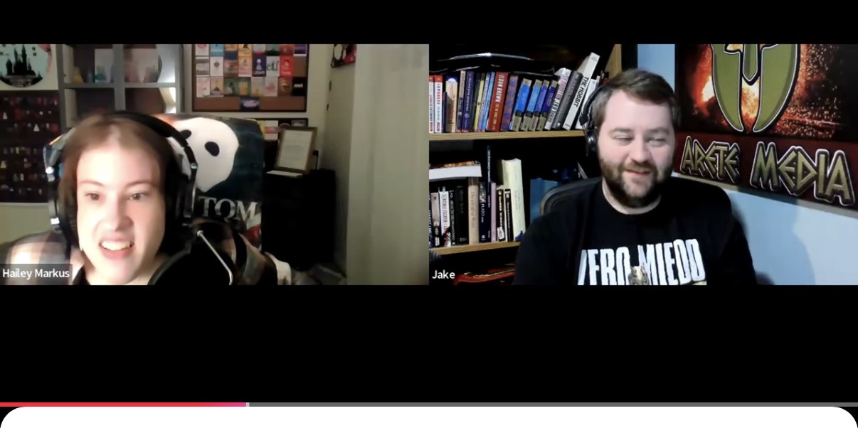 Two people are in a video call, each in separate rooms with bookshelves behind them.