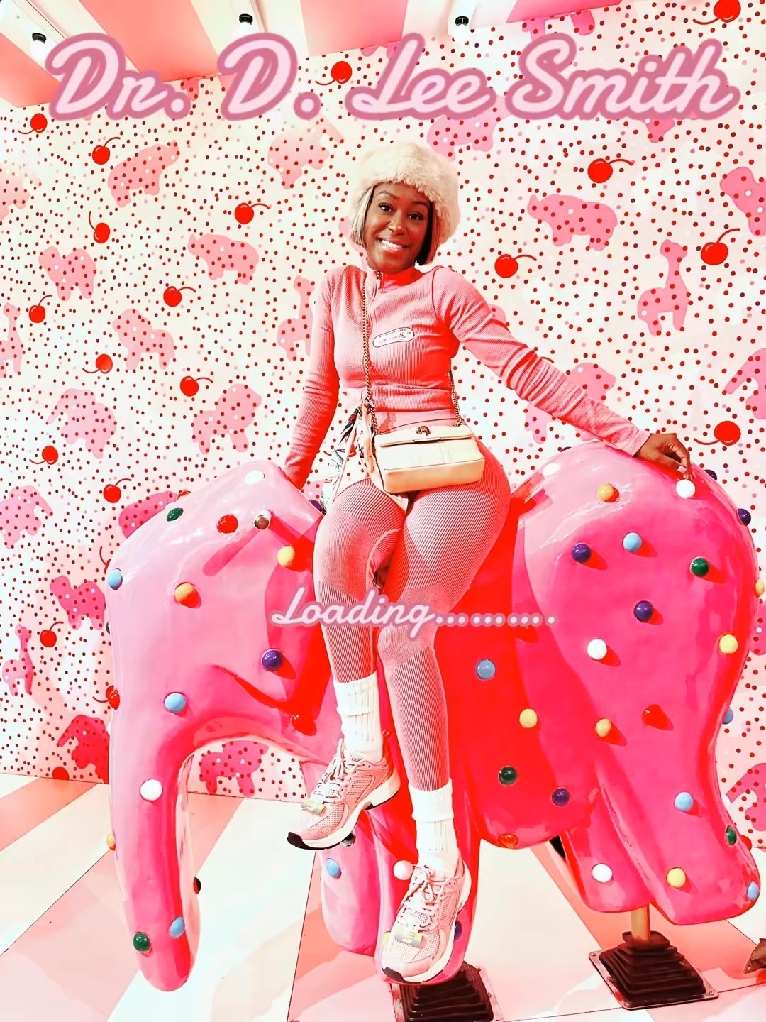 A woman in a pink outfit and white hat sitting on a pink, decorated elephant sculpture with a pink and white background.