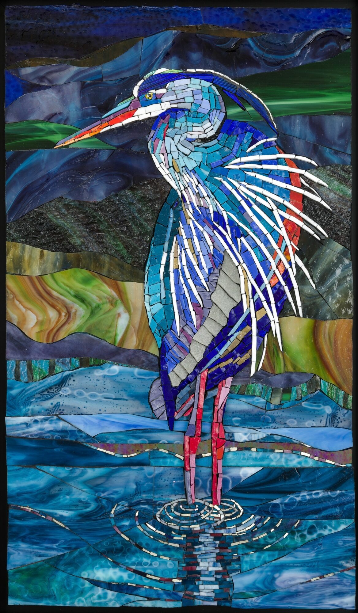 Colorful mosaic of a heron standing in water with a landscape background, using various shades of blue, green, and other colors.