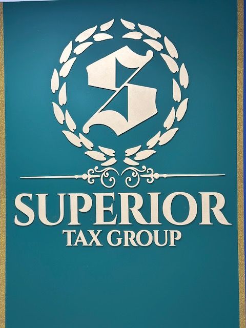 Superbior Tax Group logo with a circular wreath and a gavel, on a teal background.