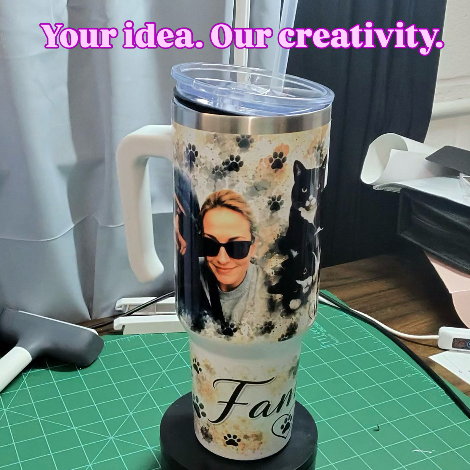 Travel mug with a person wearing sunglasses and a dog, on a green cutting mat, with text at top.