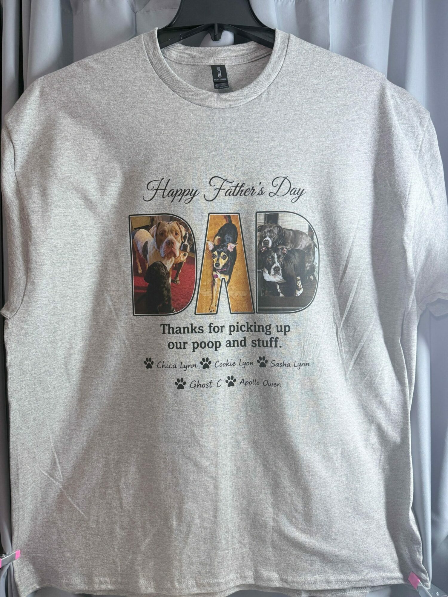 Gray T-shirt with a graphic and text, thanking fans and featuring images of a person performing and a woman, with stars.