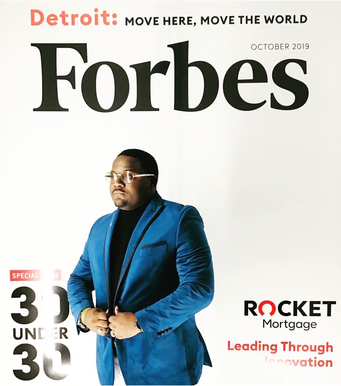 Man in blue suit and glasses on Forbes magazine cover, October 2019, with text about Detroit and Rocket Mortgage.
