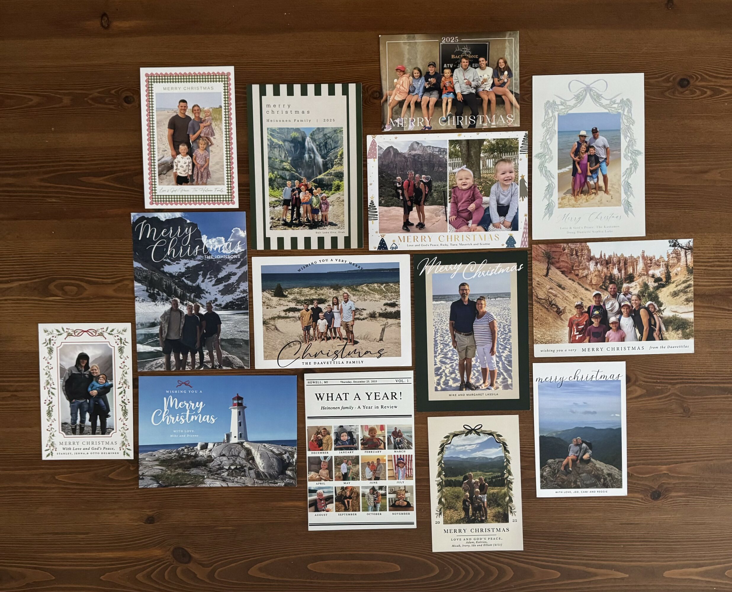 Collection of 14 photographs and cards on a wooden surface, featuring people, landscapes, and a lighthouse.