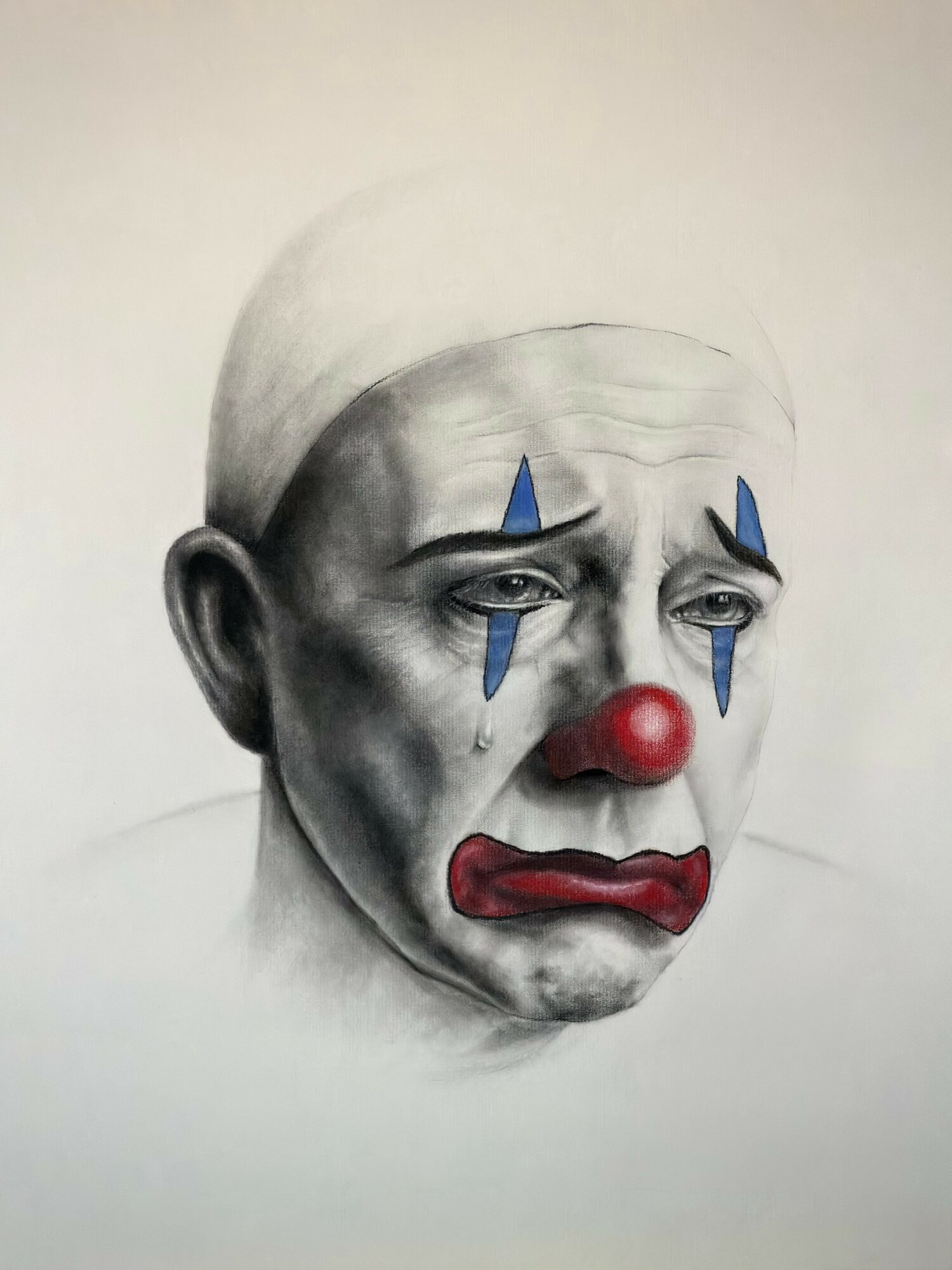 A realistic drawing of a sad clown with a red nose, blue teardrop makeup, and a white hat, showing a distressed expression.