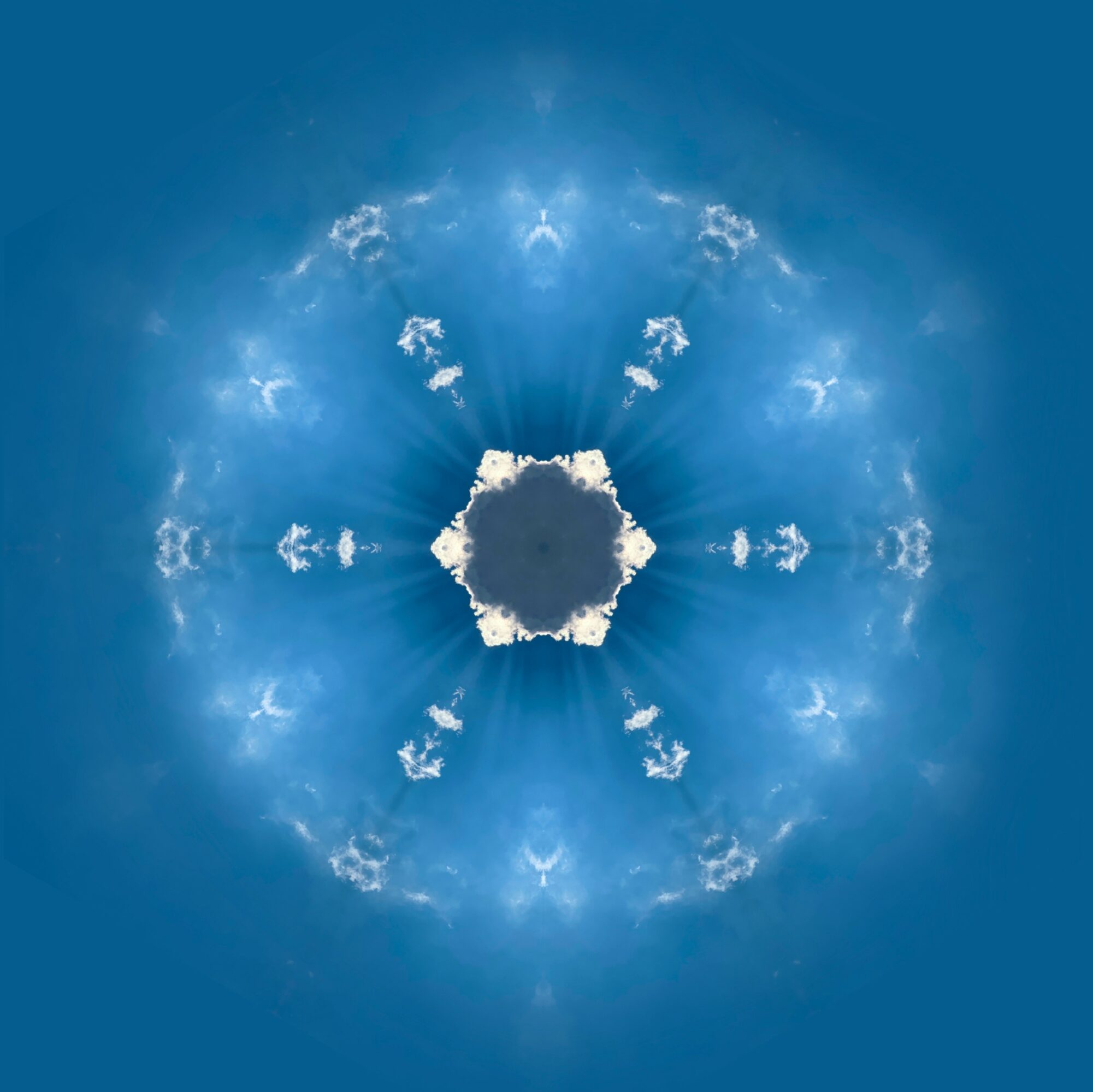 Kaleidoscopic sky with clouds radiating from a central point against a blue background.
