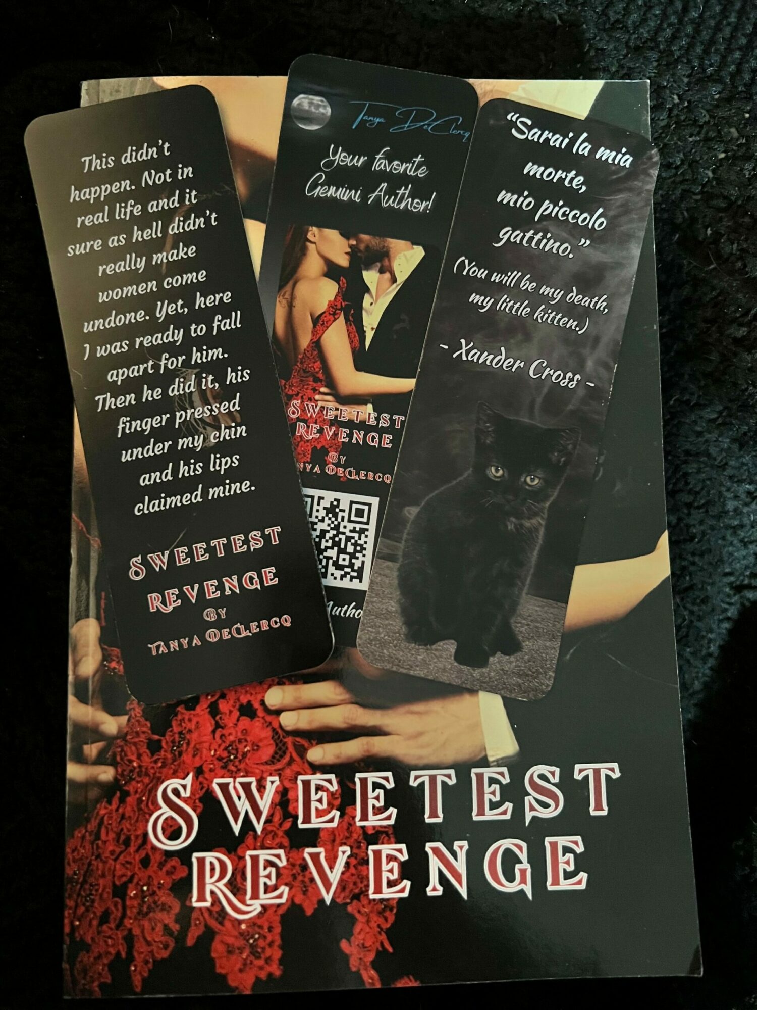 Book cover titled 'Sweetest Revenge' with a woman in a black dress holding a knife, red flowers, and a QR code.
