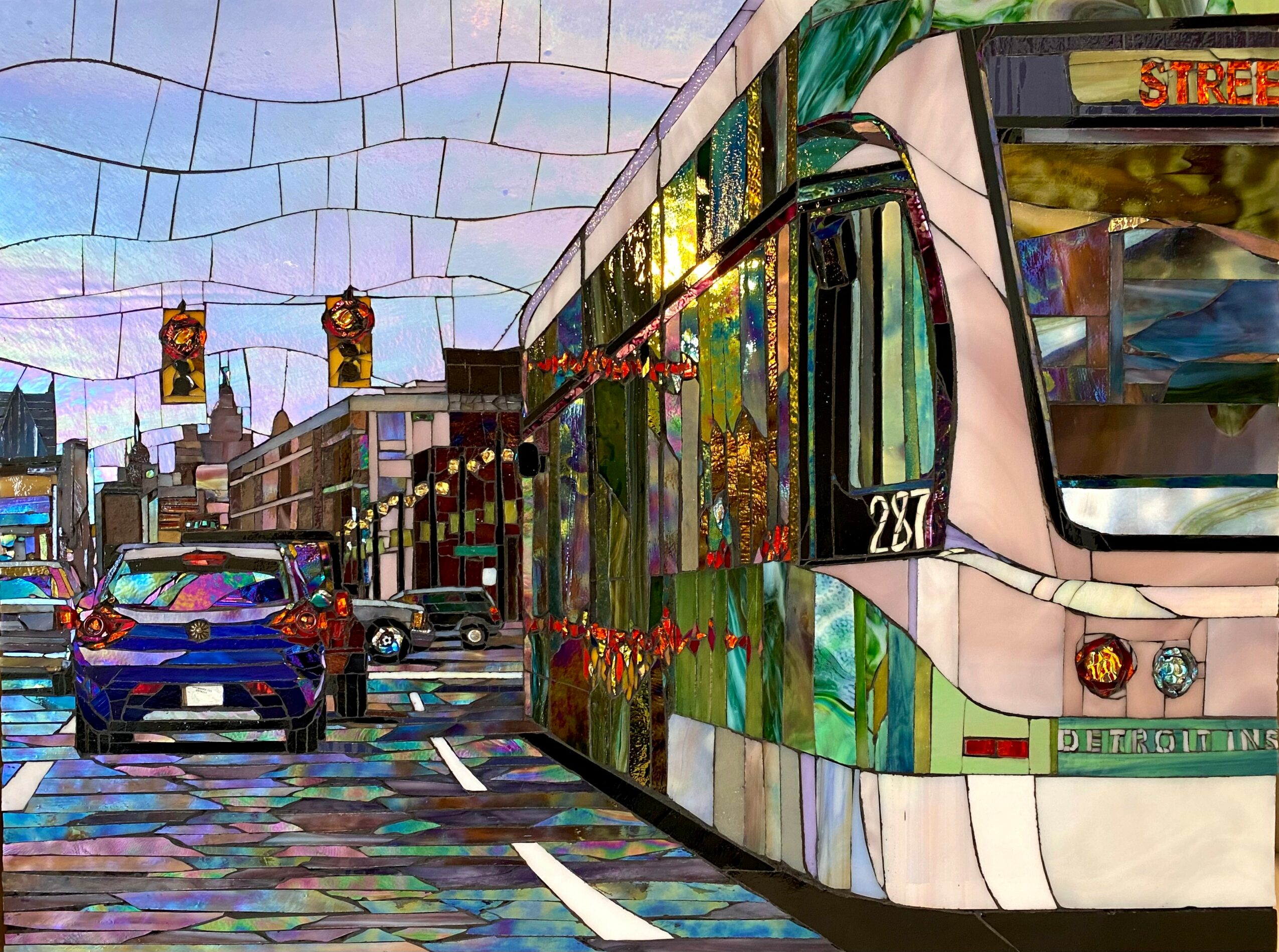 City street with a colorful tram, cars, traffic lights, and buildings in the background, depicted in a mosaic style.