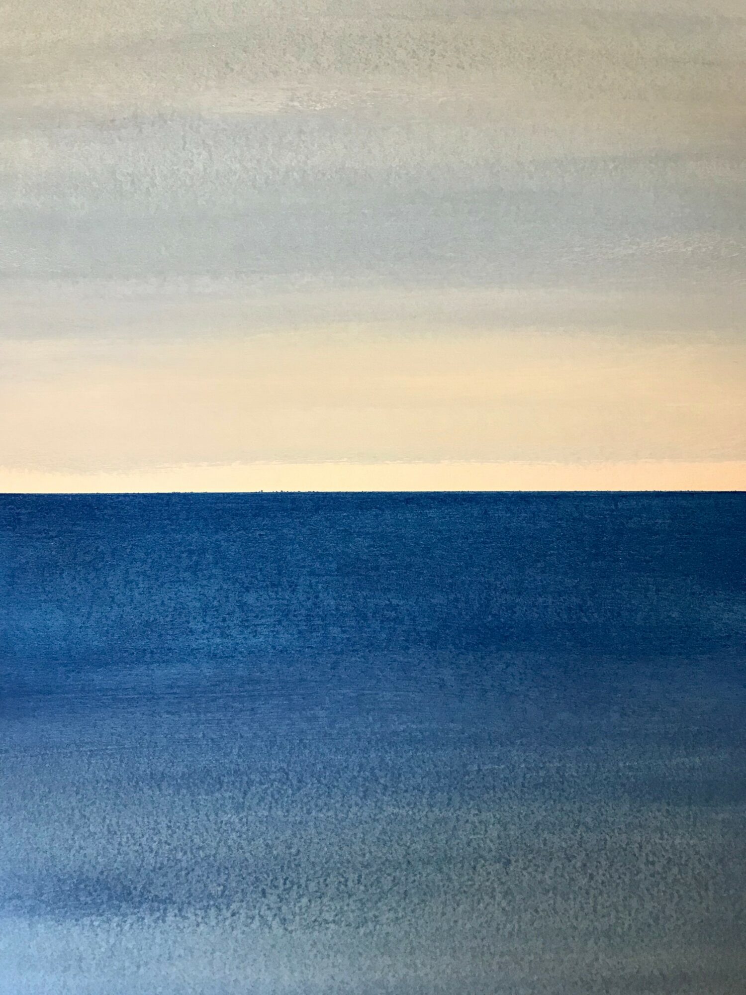 Seascape with a horizon, sky above and ocean below, in soft pastel colors.