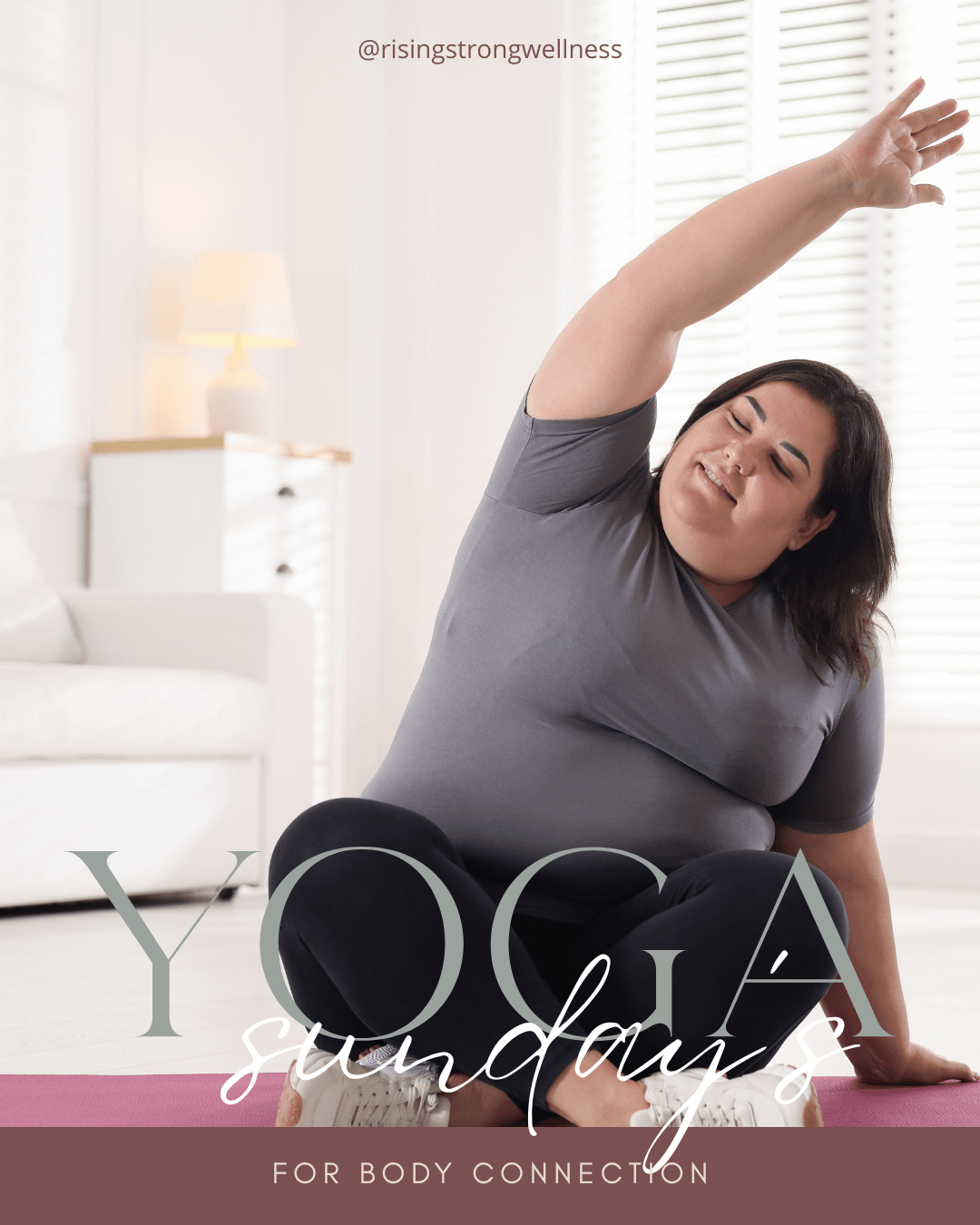 Woman practicing yoga on mat in bright room, stretching arm overhead, eyes closed, relaxed expression.