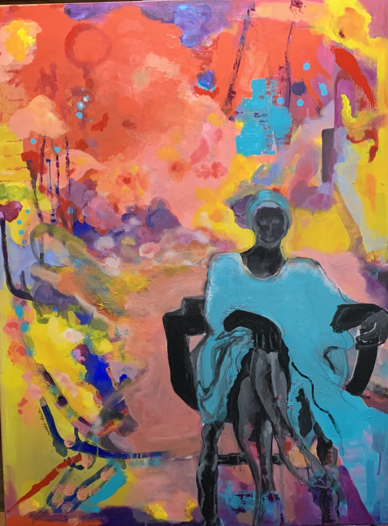A person sitting on a chair with a colorful abstract background of pink, yellow, blue, and purple splashes.